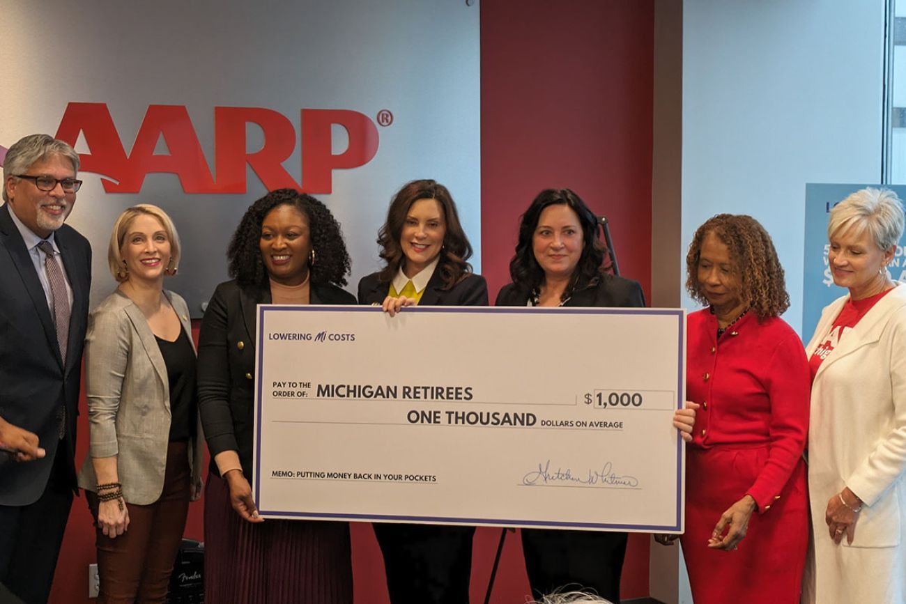 gov. gretchen whitmer holding check