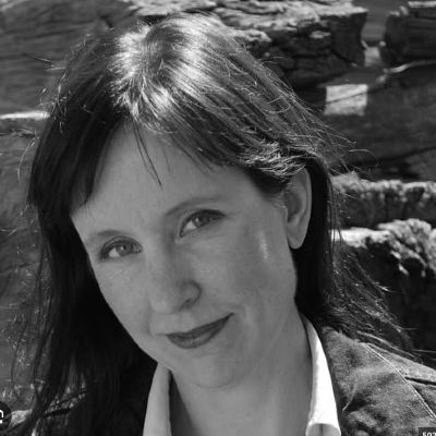 Woman headshot in black and white.